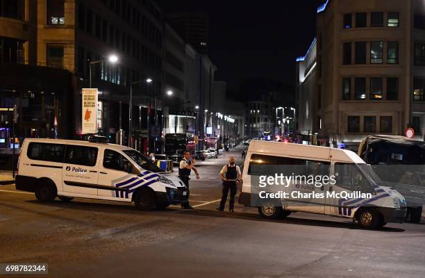 Armed police stand guard outside Brussels Central train station after a man triggered a small explosion inside the station on June 20, 2017 in...