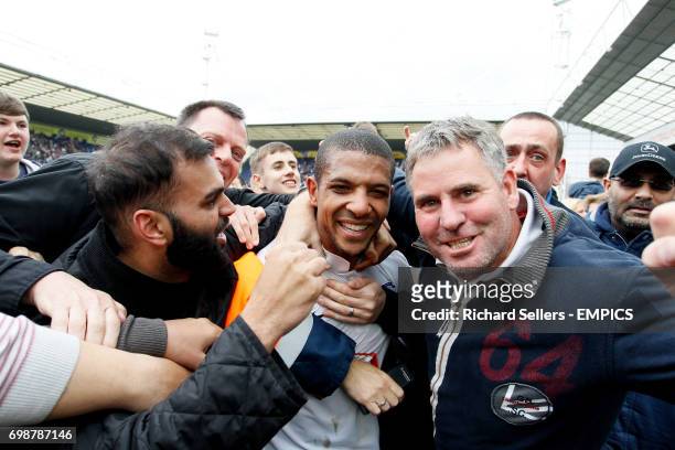 Preston's Jermaine Beckford is mobbed after their victory