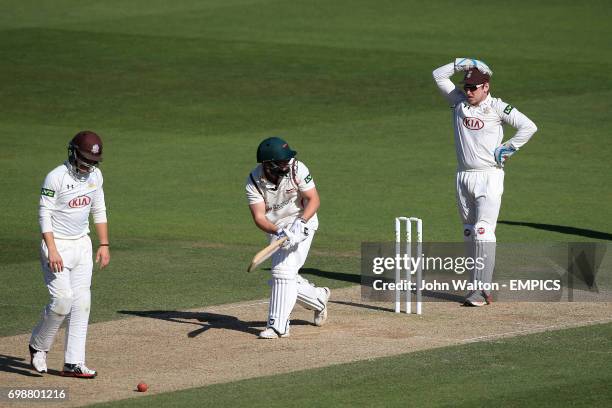 Surrey's Rory Burns and wicketkeeper Gary Wilson react after and unsuccessful appeal of Leicestershire batsman Neil Pinner