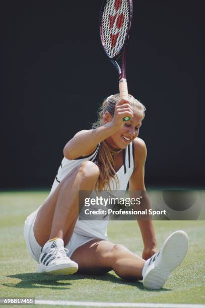 Russian tennis player Anna Kournikova pictured in action after a fall during progress to reach the fourth round of the Ladies' Singles tournament at...