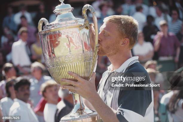 German tennis player Boris Becker pictured kissing the trophy after defeating Swedish tennis player Stefan Edberg 6-4, 7-6 to win the final of the...