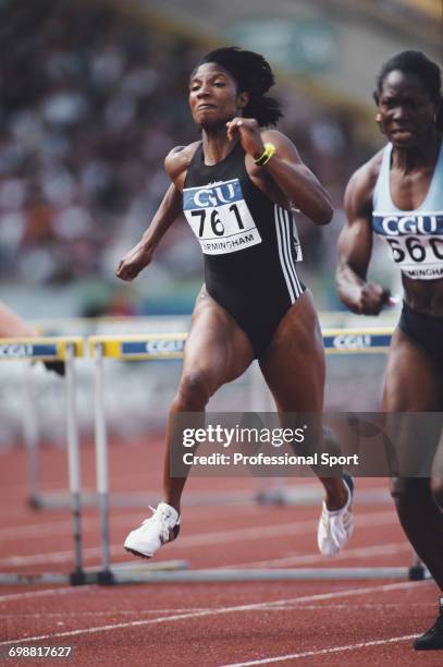 English track and field athlete Denise Lewis competes in the 100 metres hurdles discipline of the heptathlon event at the Amateur Athletics...