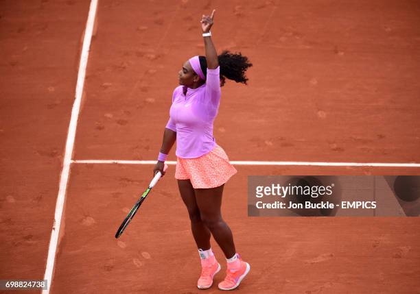 Serena Williams celebrates winning her 1st round women's singles match against Andrea Hlavackova on day three of the French Open at Roland Garros on...