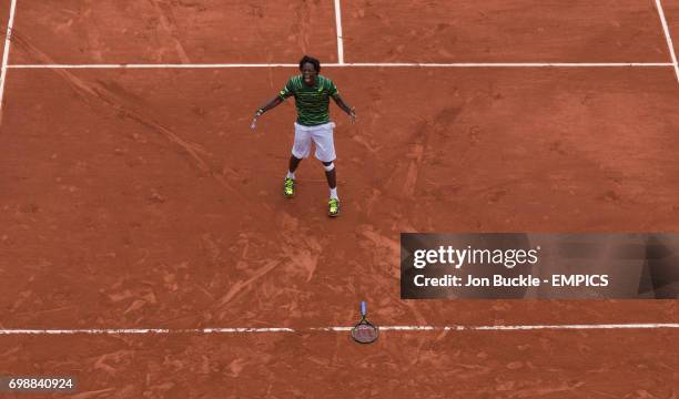 Gael Monfils celebrates match point during his victory against Pablo Cuevas during his 3rd round men's singles match on day six of the French Open at...