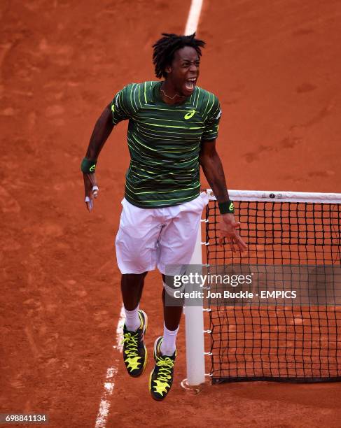 Gael Monfils celebrates his victory against Pablo Cuevas during his 3rd round men's singles match on day six of the French Open at Roland Garros on...