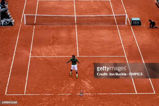 Gael Monfils celebrates his victory against Pablo Cuevas during his 3rd round men's singles match on day six of the French Open at Roland Garros on...