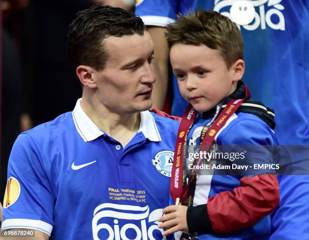 Dnipro Dnipropetrovsk's Artem Fedetskiy and his son following his team's defeat