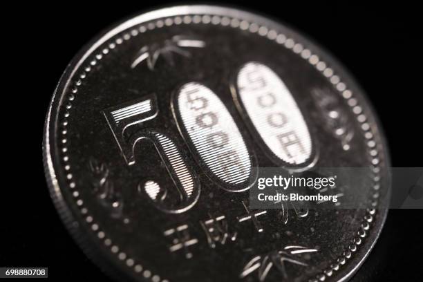 Japanese 500 yen coin is arranged for a photograph in Tokyo, Japan, on Tuesday, June 20, 2017. Japans Cabinet Office will release its monthly...