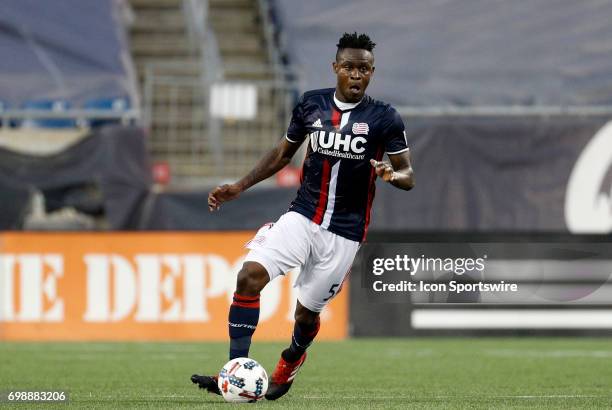 New England Revolution midfielder Gershon Koffie looks up field during a regular season MLS match between the New England Revolution and the Chicago...