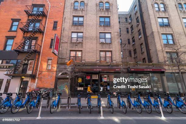 many citi bikes in the dock at east village street manhattan new york city. - east village stock pictures, royalty-free photos & images