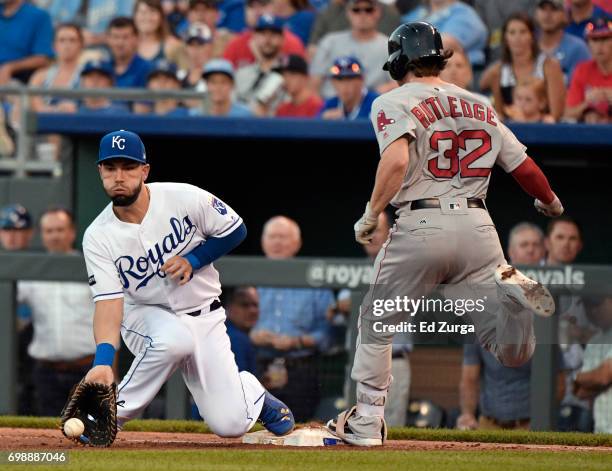 Josh Rutledge of the Boston Red Sox beats the throw to Eric Hosmer of the Kansas City Royals for a single in the fourth inning at Kauffman Stadium on...