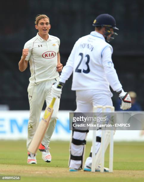Surrey's James Burke celebrates the wicket of Derbyshire's Tom Poynton