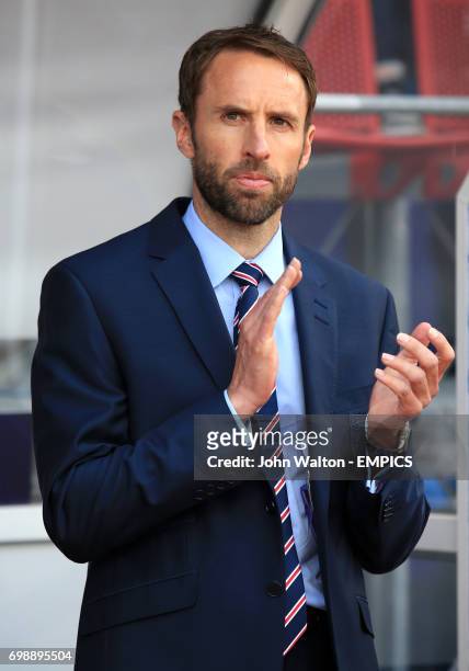 England manager Gareth Southgate claps on his team