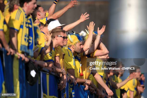 Sweden fans cheer on their side in the stands