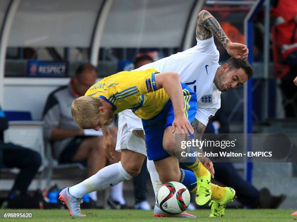 England's Danny Ings and Sweden's Filip Helander battle for the ball