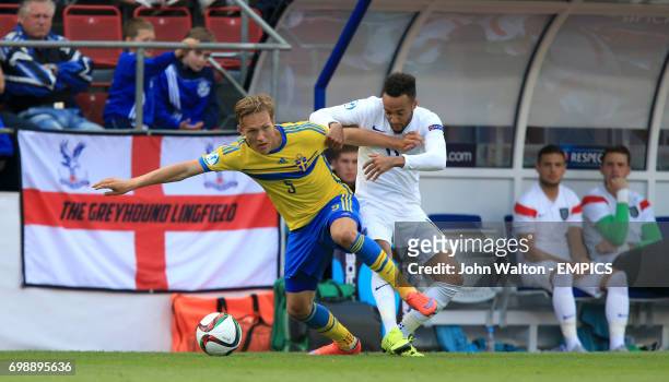 England's Nathan Redmond and Sweden's Ludwig Augustinsson battle for the ball
