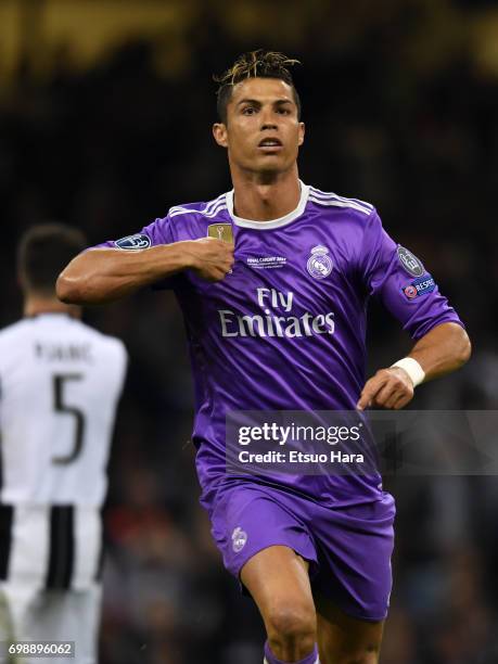 Cristiano Ronaldo of Real Madrid celebrates scoring the opening goal during the UEFA Champions League final match between Juventus and Real Madrid at...