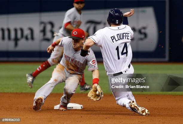 Second baseman Scooter Gennett of the Cincinnati Reds catches Trevor Plouffe of the Tampa Bay Rays attempting to steal second base to end the seventh...