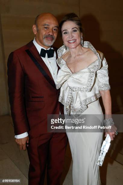Stylist Christian Louboutin and Becca Cason Thrash attend the "Liaisons au Louvre IV" - Evening of patronage for the benefit of the Louvre Museum at...