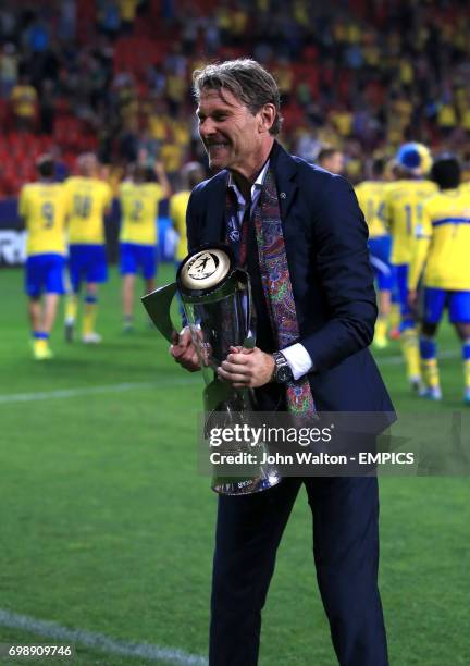 Sweden manager Hakan Ericson celebrates with the UEFA European Under-21 Championship trophy