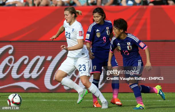 England's Ellen White battles for the ball with Japan's Nahomi Kawasumi and Saori Ariyoshi during the FIFA Women's World Cup Canada 2015 Semi Final...