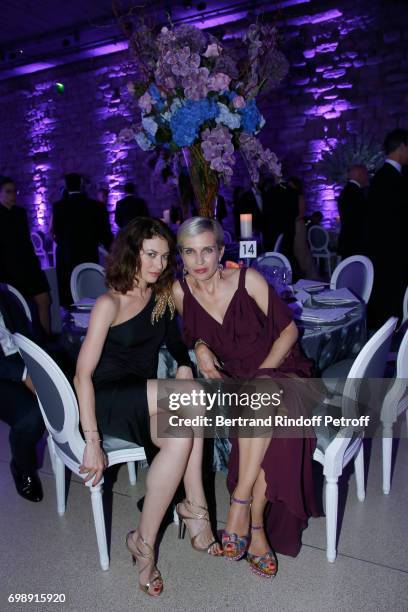 Olga Kurylenko and Melita Toscan du Plantier attend the "Liaisons au Louvre IV" - Evening of patronage for the benefit of the Louvre Museum at Musee...