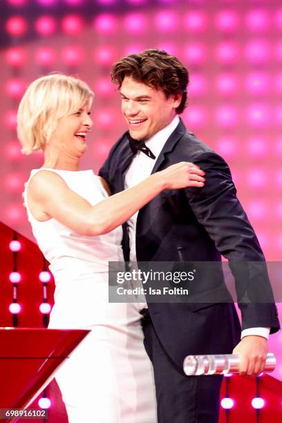 German presenter Barbara Hahlweg with an award winner during the Deutscher Gruenderpreis on June 20, 2017 in Berlin, Germany.