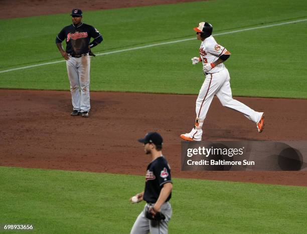 The Baltimore Orioles' Manny Machado, top right, rounds the bases past Cleveland Indians infielder Jose Ramirez, top left, and pitcher Josh Tomlin...