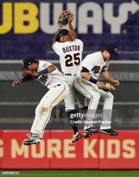 Eddie Rosario, Byron Buxton and Max Kepler of the Minnesota Twins celebrate winning the game against the Chicago White Sox on June 20, 2017 at Target...
