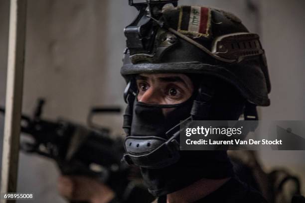 Commando of 7 men of the 1st brigade of the ISOF fights Daesh, house by house, to take control of Al Saha, one of the last districts of Mosul be...