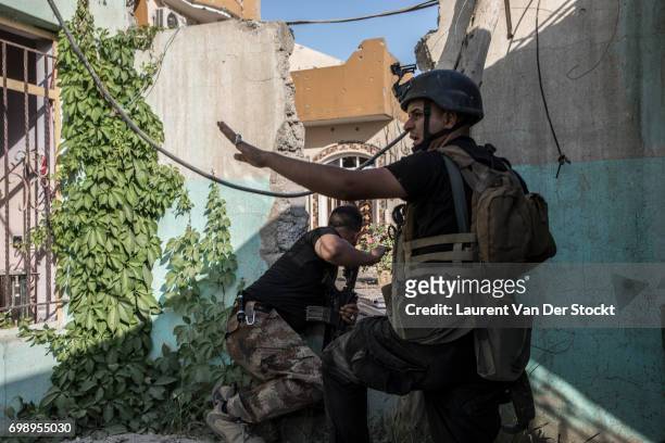 Commando of 7 men of the 1st brigade of the ISOF fights Daesh, house by house, to take control of Al Saha, one of the last districts of Mosul be...