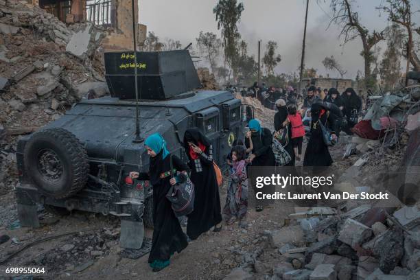 Hundreds of exhausted and panicked civilians flee Bab Sinjar, Zanjili and Abi Tamam, the 3 districts on the north side of Mosul's Old City, which is...