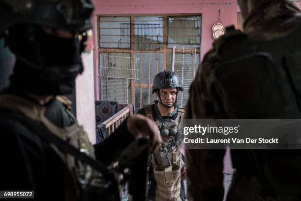 Commando of 7 men of the 1st brigade of the ISOF fights Daesh, house by house, to take control of Al Saha, one of the last districts of Mosul be...