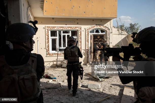 Commando of 7 men of the 1st brigade of the ISOF fights Daesh, house by house, to take control of Al Saha, one of the last districts of Mosul be...