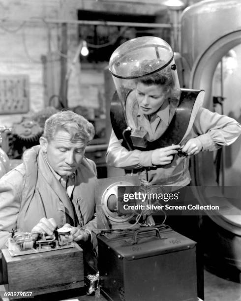 Actors Spencer Tracy as military research scientist Pat Jamieson and Katharine Hepburn as his wife Jamie Rowan in the romantic comedy film 'Without...