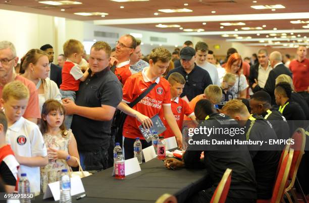 Charlton Athletic supporters meet players during a signing session on fun day.