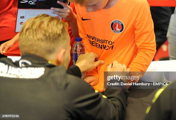 Charlton Athletic supporters meet players during a signing session on fun day.