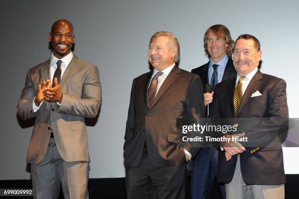 Remi Adeleke, Frank Welker, Michael Bay, and Peter Cullen speak onstage at the US premiere of "Transformers: The Last Knight" at the Civic Opera...