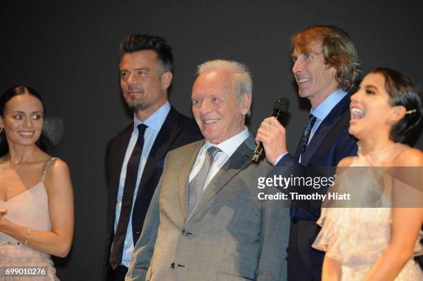 Laura Haddock, Josh Duhamel, Sir Anthony Hopkins, Michael Bay, and Isabela Moner speak onstage at the US premiere of "Transformers: The Last Knight"...