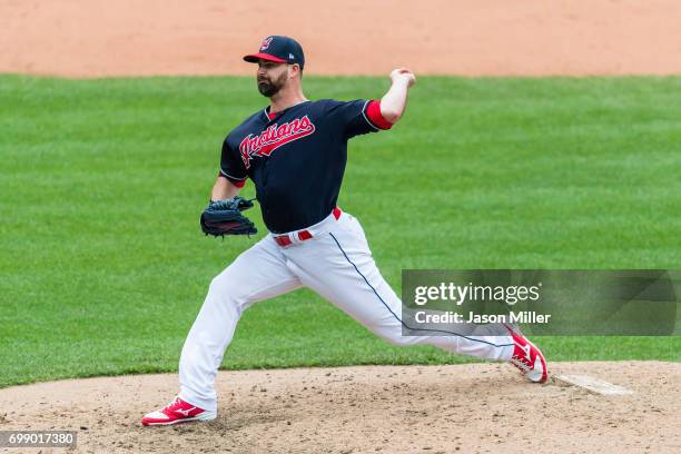 Relief pitcher Boone Logan of the Cleveland Indians warms up during the sixth inning against the Seattle Mariners at Progressive Field on April 30,...