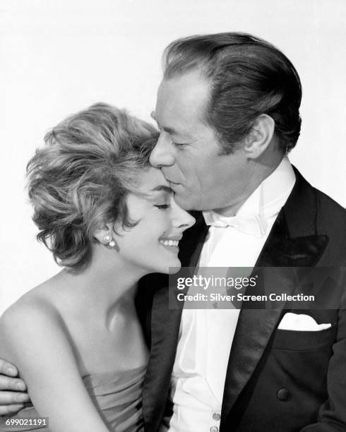 Actors Rex Harrison as Jimmy Broadbent and Kay Kendall as Sheila Broadbent in a publicity still for 'The Reluctant Debutante', 1958.