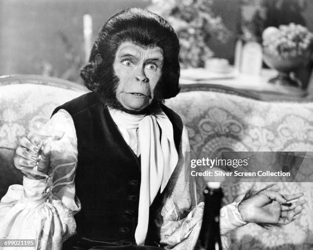 Actress Kim Hunter as Zira, partaking in a drink of champagne in a scene from the film 'Escape from the Planet of the Apes', 1971.