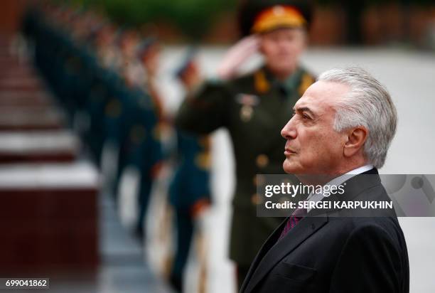 Brazil's President Michel Temer takes part in a wreath-laying ceremony at the Tomb of the Unknown Soldier by the Kremlin wall in Moscow on June 21,...