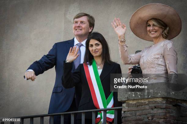 King Willem-Alexander and Queen Maxima of Netherlands stand on the balcony at Rome City Hall during a visit with Rome's mayor Virginia Raggi on June...