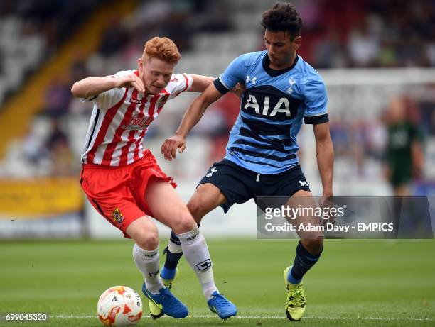 Stevenage's Dale Gorman and Tottenham Hotspur's Ismail Azzaoui battle for the ball