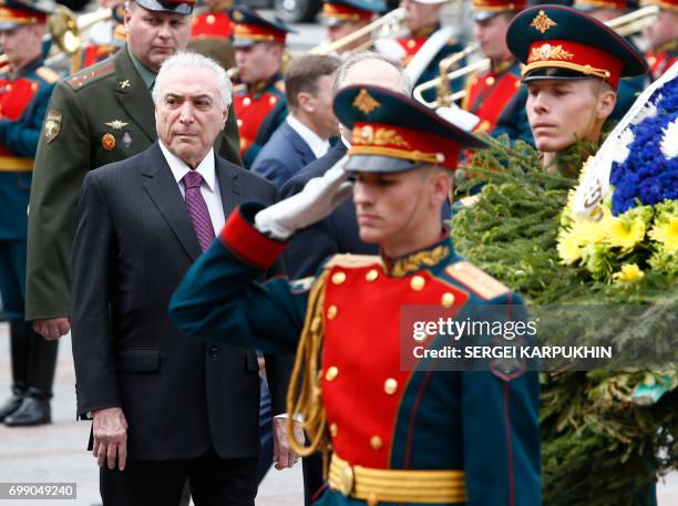 Brazil's President Michel Temer takes part in a wreath-laying ceremony at the Tomb of the Unknown Soldier by the Kremlin wall in Moscow on June 21,...