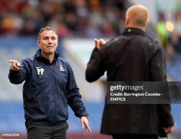 Bradford City manager Phil Parkinson speaks to Burnley manager Sean Dyche