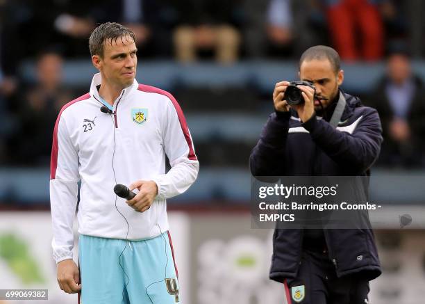 Burnley's Michael Duff is photographed by the media
