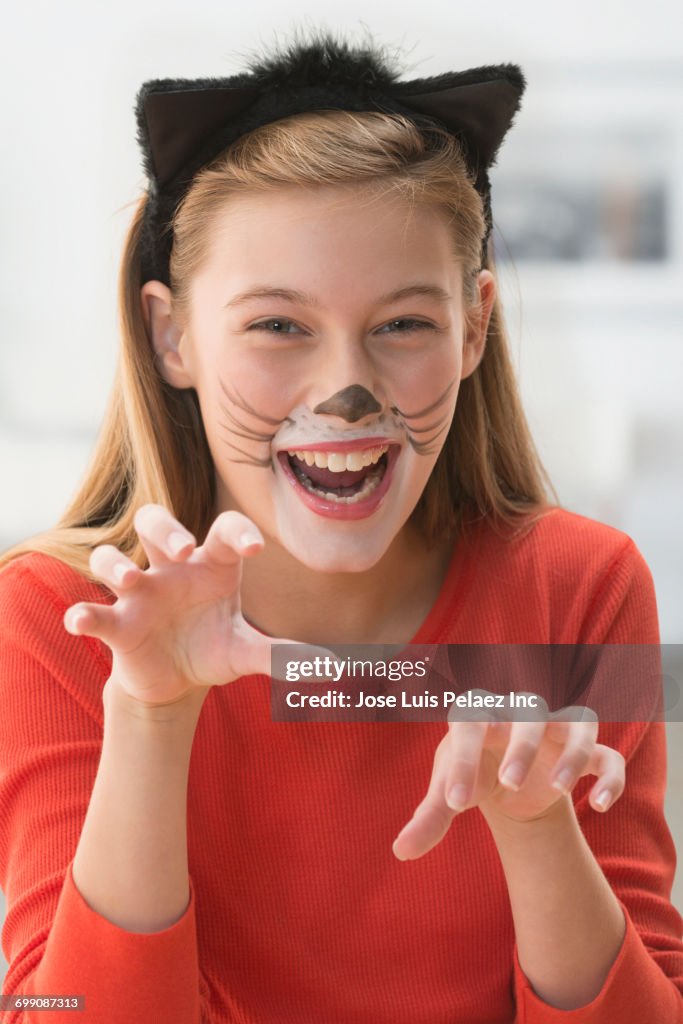 Caucasian girl wearing cat costume