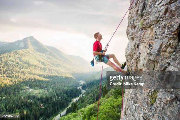 caucasian man rock climbing - salt lake city stock pictures, royalty-free photos & images